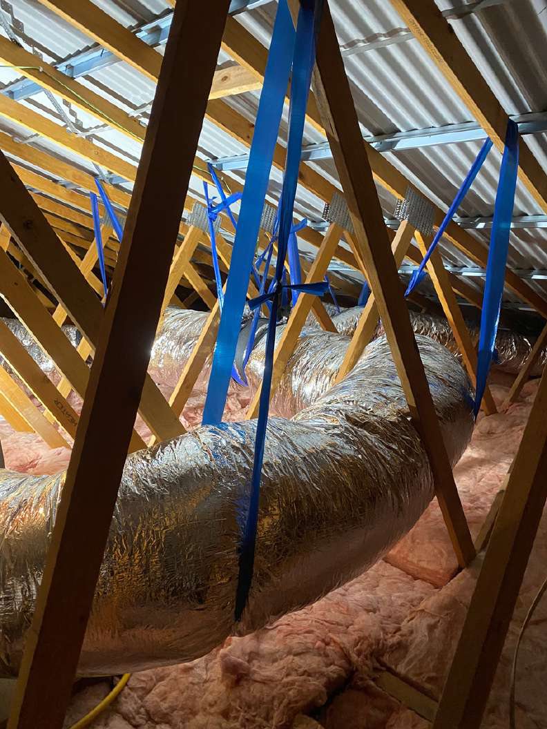 New R1.5-rated flexible ducting installed and strapped to roof timbers