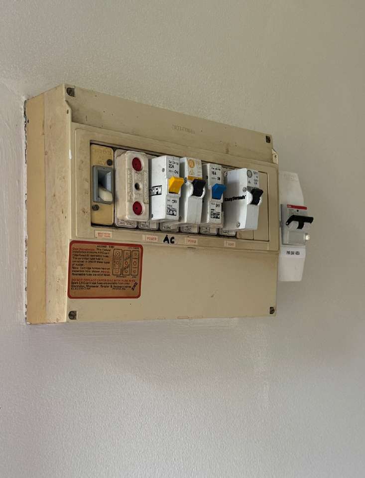 Old non-compliant switchboard with ceramic fuses