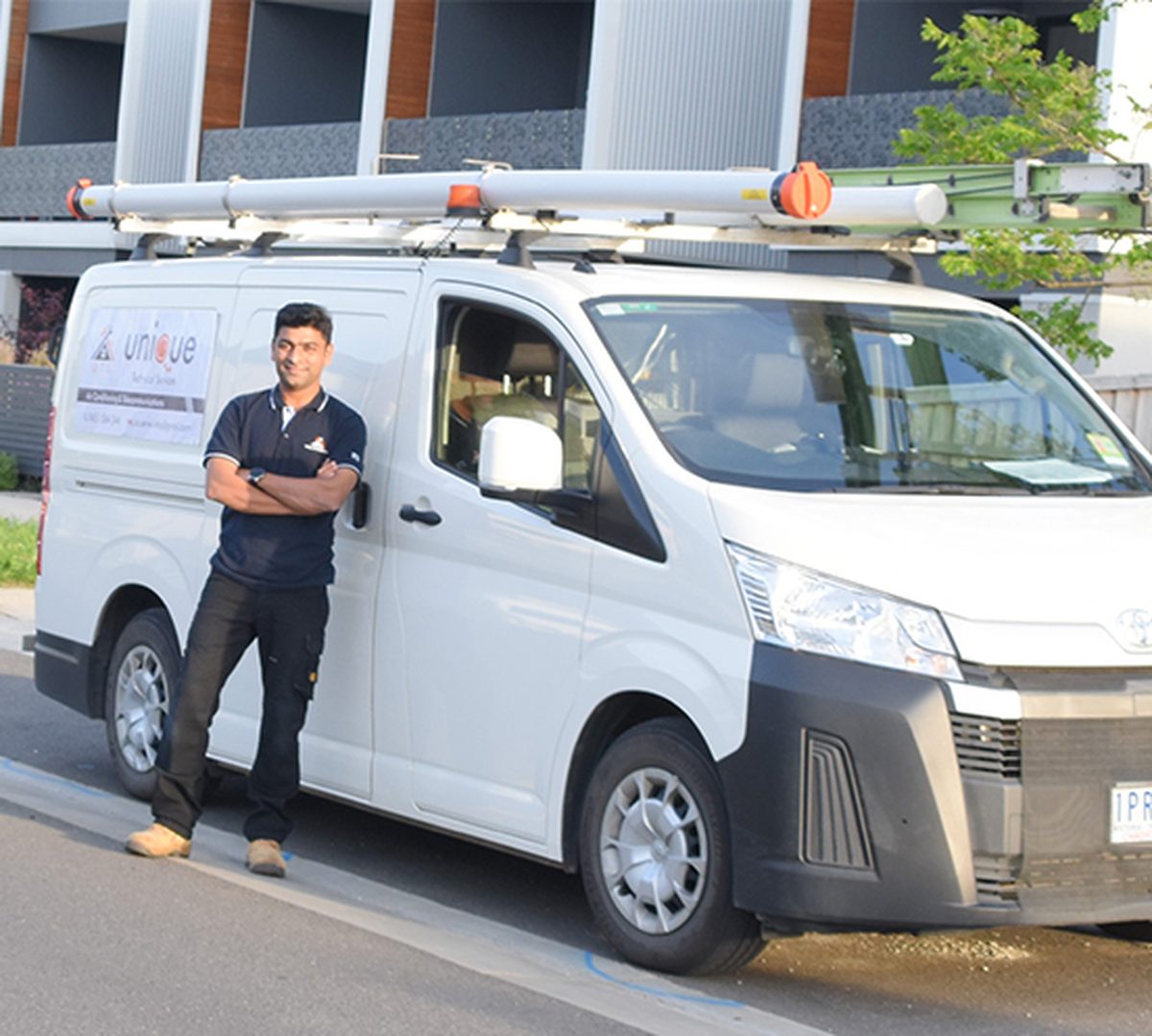 Unique Technical Services work van outside a customer home